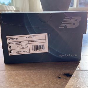 Black pair of New Balance high top shoes. Very comfortable, never been worn. New